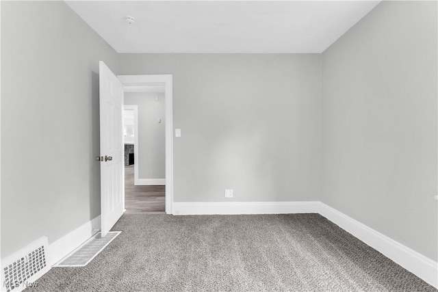 3670 E 138th St, Cleveland, OH 44120 - carpeted spare room with baseboards and a smoke detector