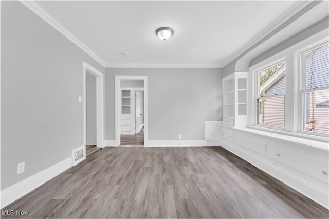 3670 E 138th St, Cleveland, OH 44120 - unfurnished room with crown molding and wood finished floors