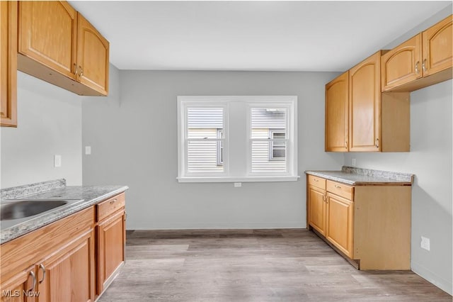 3670 E 138th St, Cleveland, OH 44120 - kitchen with light wood-style flooring and light countertops