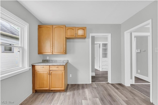 3670 E 138th St, Cleveland, OH 44120 - kitchen featuring light countertops, light wood-type flooring, and light brown cabinetry