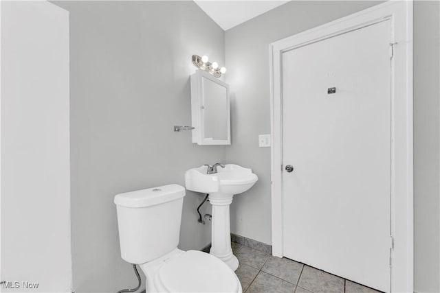3670 E 138th St, Cleveland, OH 44120 - bathroom with toilet and tile patterned floors