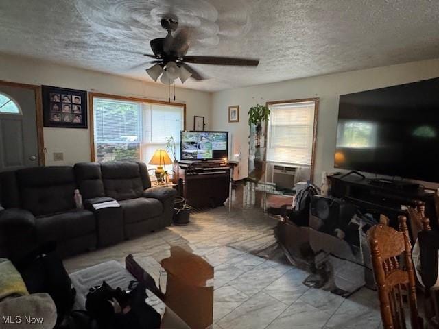 5919 N Bend Rd, Ashtabula, OH 44004 - living area with a textured ceiling, ceiling fan, healthy amount of natural light, and cooling unit