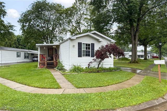 11 Brookins Dr, Olmsted Twp, OH 44138 - manufactured / mobile home featuring a front lawn