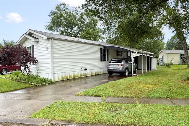 11 Brookins Dr, Olmsted Twp, OH 44138 - view of front of house with a front yard, concrete driveway, and a carport