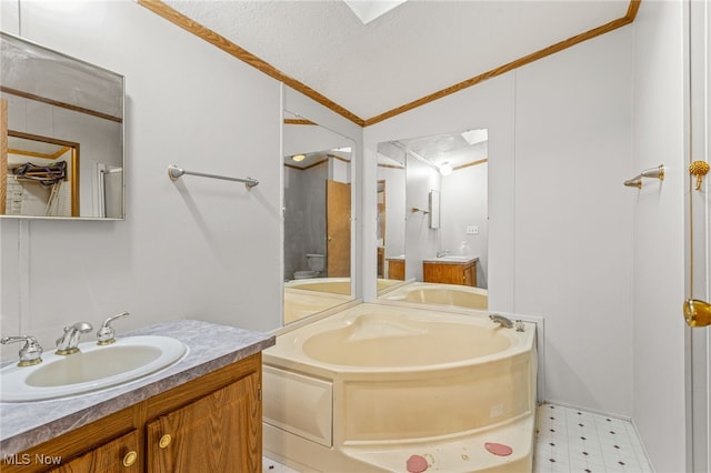 11 Brookins Dr, Olmsted Twp, OH 44138 - bathroom featuring tile patterned floors, a garden tub, vanity, vaulted ceiling, and crown molding