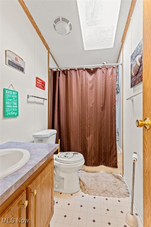 11 Brookins Dr, Olmsted Twp, OH 44138 - bathroom featuring a skylight, vanity, and shower / bath combo