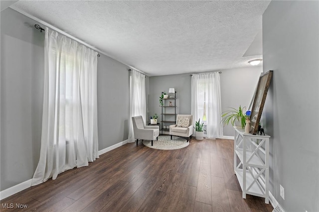 1500 Furnace St, Mineral Ridge, OH 44440 - sitting room featuring a textured ceiling and dark wood-type flooring