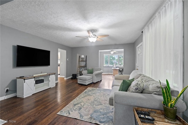 1500 Furnace St, Mineral Ridge, OH 44440 - living area with ceiling fan, dark wood-style floors, and a textured ceiling