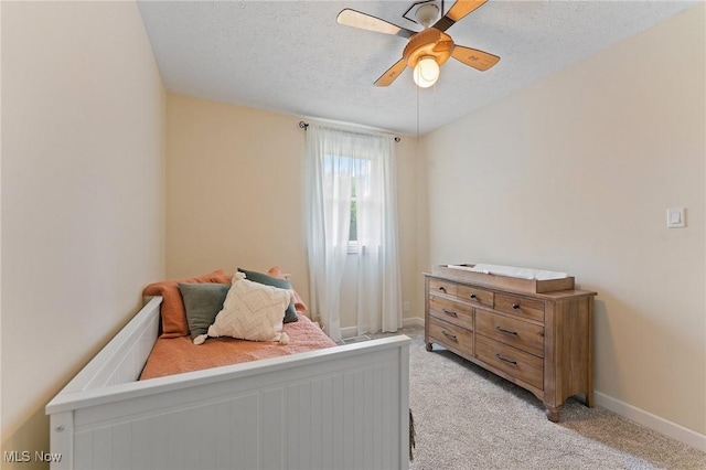 1500 Furnace St, Mineral Ridge, OH 44440 - bedroom with light carpet, a textured ceiling, and ceiling fan