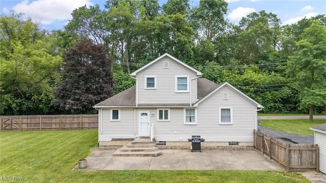 1500 Furnace St, Mineral Ridge, OH 44440 - rear view of property featuring a patio, a fenced backyard, a shingled roof, and view of scattered trees