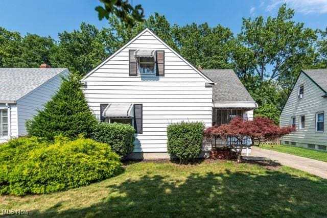 427 E 275th St, Euclid, OH 44132 - view of home's exterior with a lawn