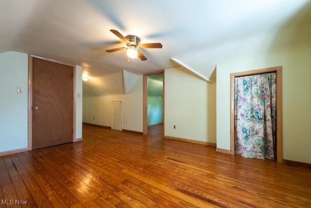 427 E 275th St, Euclid, OH 44132 - unfurnished living room with a ceiling fan, lofted ceiling, and wood finished floors