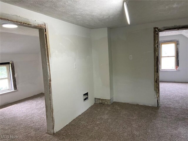 1122 W 17th St, Lorain, OH 44052 - carpeted spare room with a textured ceiling