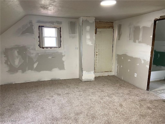 1122 W 17th St, Lorain, OH 44052 - unfurnished bedroom featuring carpet and vaulted ceiling