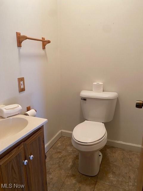911 32nd St, Parkersburg, WV 26104 - half bathroom with vanity and tile patterned flooring