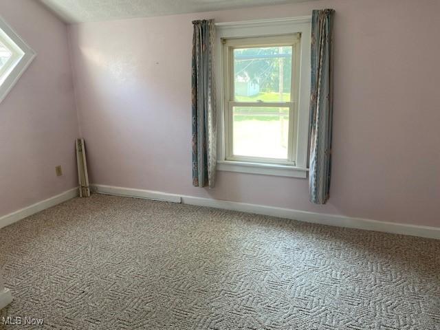 911 32nd St, Parkersburg, WV 26104 - empty room with carpet floors and baseboards