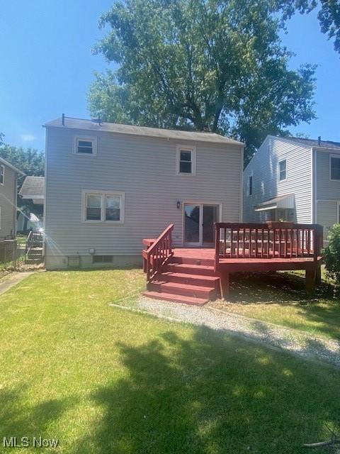 911 32nd St, Parkersburg, WV 26104 - back of house featuring a deck and a yard