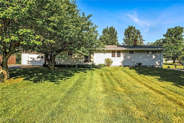 1808 Depot Rd, Salem, OH 44460 - back of house with a yard and a chimney
