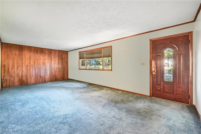 1808 Depot Rd, Salem, OH 44460 - carpeted foyer featuring a textured ceiling, ornamental molding, and wood walls