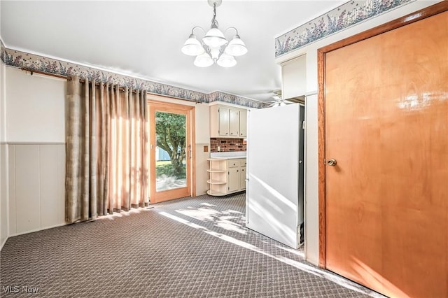 1808 Depot Rd, Salem, OH 44460 - unfurnished dining area featuring a chandelier and light carpet