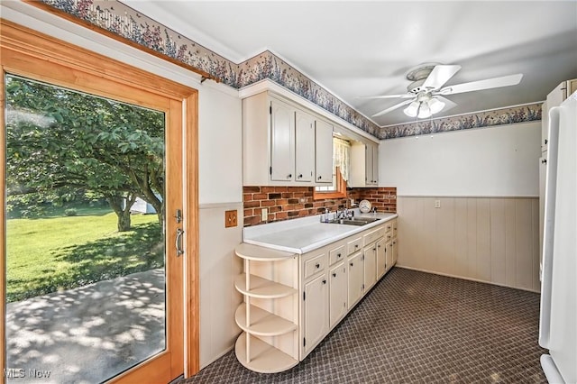 1808 Depot Rd, Salem, OH 44460 - kitchen featuring a wainscoted wall, ceiling fan, light countertops, open shelves, and fridge