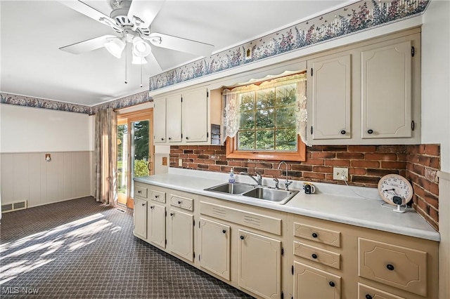 1808 Depot Rd, Salem, OH 44460 - kitchen with a wainscoted wall, a ceiling fan, light countertops, and dark carpet