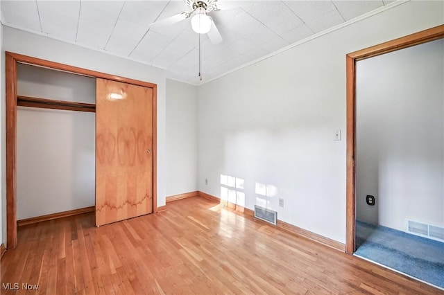1808 Depot Rd, Salem, OH 44460 - unfurnished bedroom with light wood-type flooring, a closet, ceiling fan, and ornamental molding
