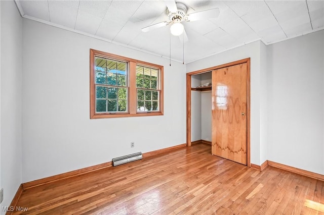 1808 Depot Rd, Salem, OH 44460 - unfurnished bedroom with light wood-style floors, a closet, a baseboard radiator, a ceiling fan, and ornamental molding