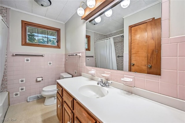1808 Depot Rd, Salem, OH 44460 - full bathroom featuring ornamental molding, tile walls, vanity, and a wainscoted wall