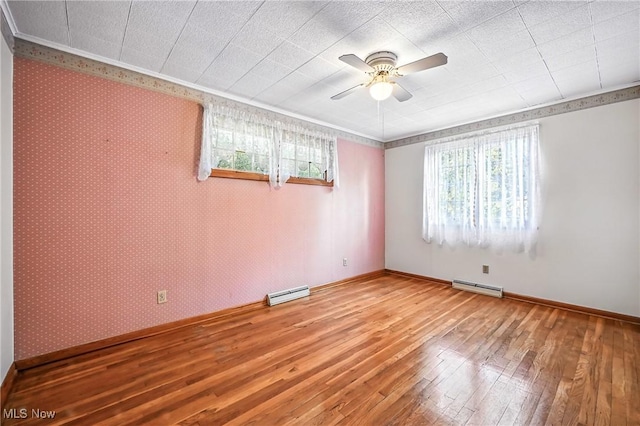 1808 Depot Rd, Salem, OH 44460 - unfurnished room featuring hardwood / wood-style flooring, ceiling fan, baseboard heating, and ornamental molding