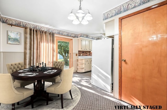 1808 Depot Rd, Salem, OH 44460 - dining area featuring a chandelier, carpet flooring, and a wainscoted wall