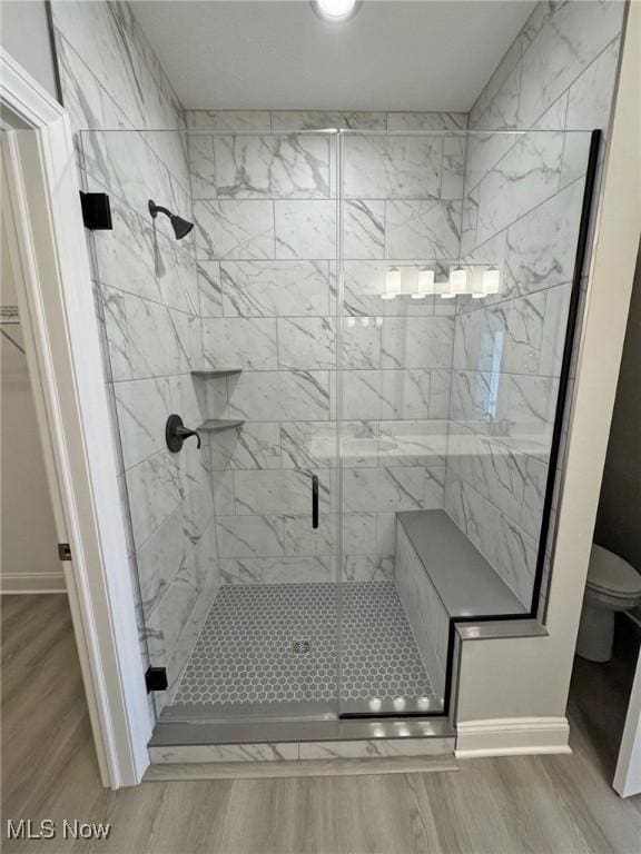 32054 Tuscan Ln Unit L-2, Avon Lake, OH 44012 - full bath featuring a shower stall and wood finished floors