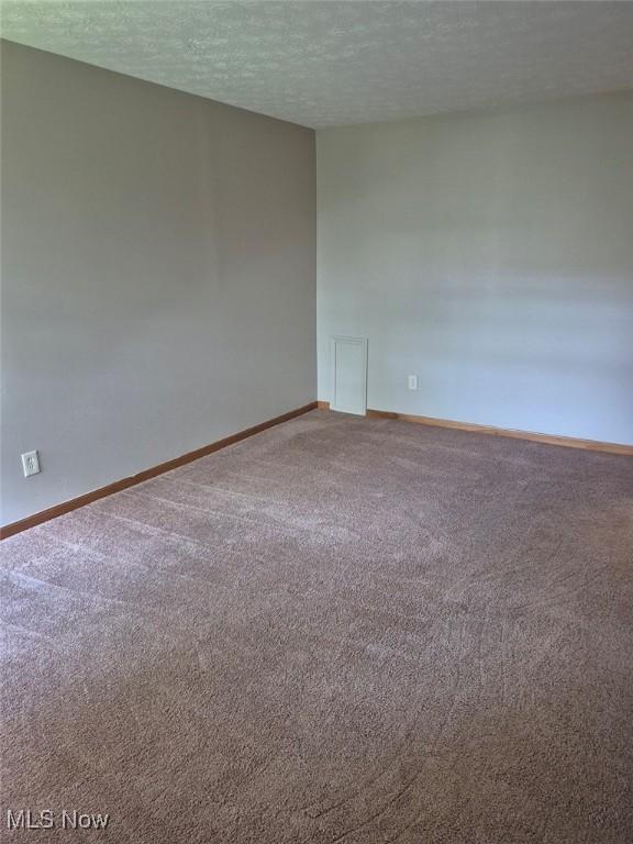 4360 Inner Circle Dr Unit C14, Brunswick, OH 44212 - empty room with carpet floors and a textured ceiling