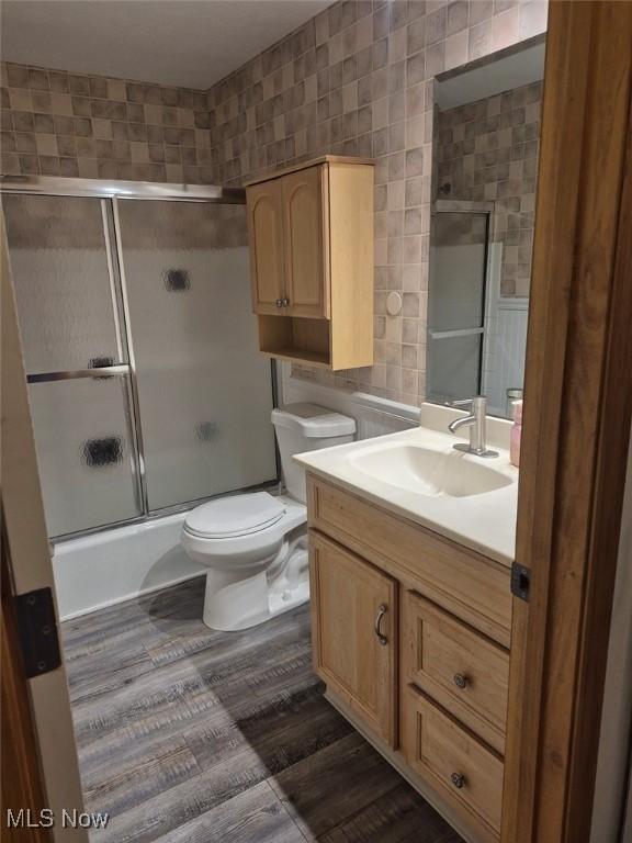 4360 Inner Circle Dr Unit C14, Brunswick, OH 44212 - bathroom with vanity, bath / shower combo with glass door, and tile walls