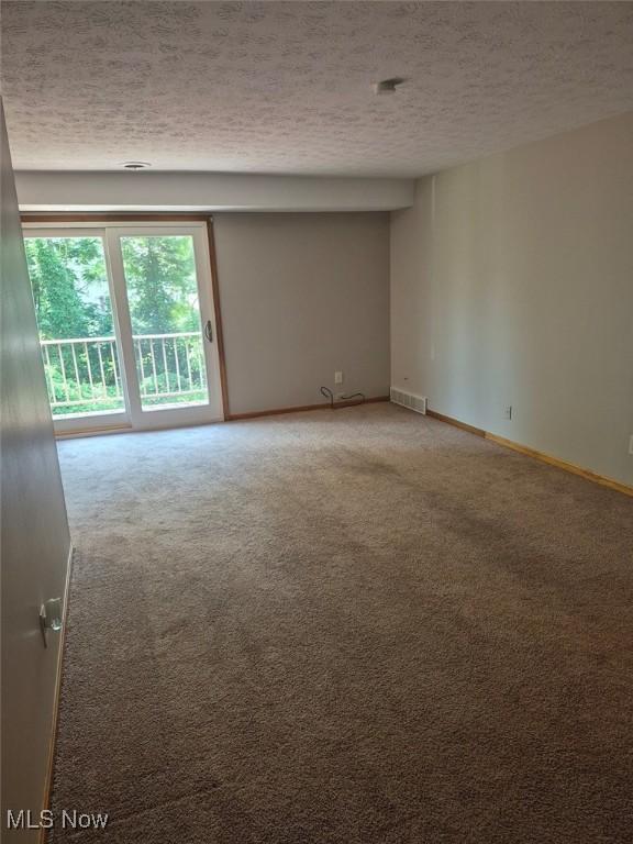 4360 Inner Circle Dr Unit C14, Brunswick, OH 44212 - empty room featuring light carpet and a textured ceiling