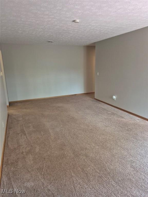 4360 Inner Circle Dr Unit C14, Brunswick, OH 44212 - carpeted empty room with a textured ceiling and baseboards