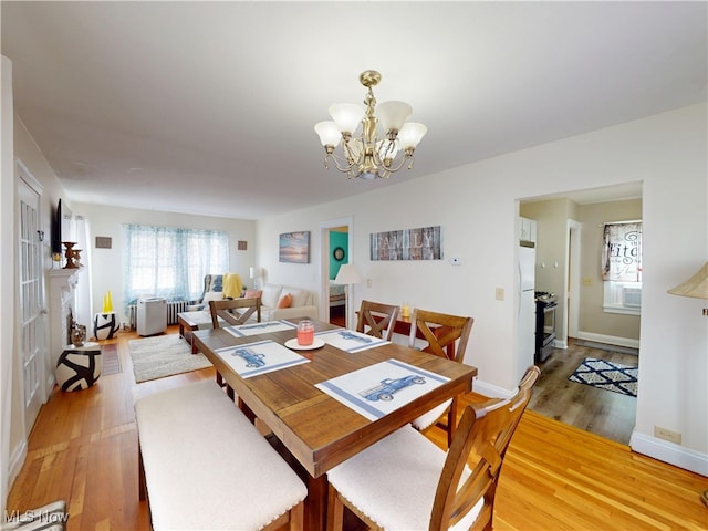 1907 Robindale St, Wickliffe, OH 44092 - dining area featuring light wood-style floors and a chandelier