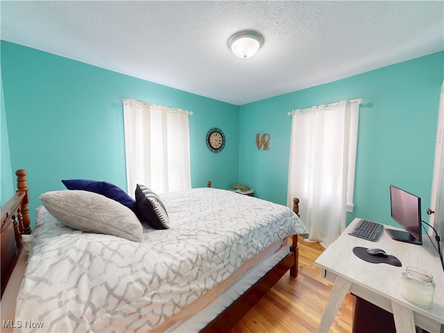 1907 Robindale St, Wickliffe, OH 44092 - bedroom with wood finished floors and a textured ceiling