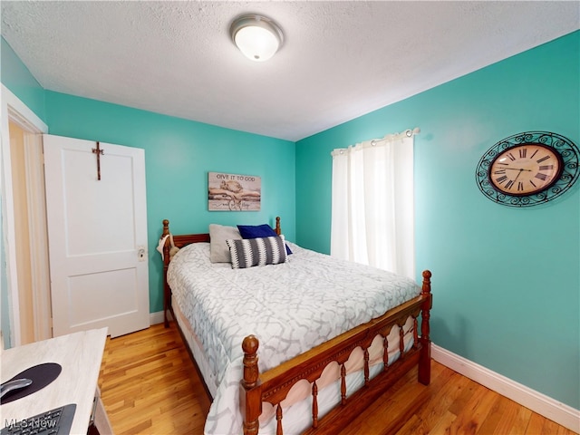 1907 Robindale St, Wickliffe, OH 44092 - bedroom with light wood-style floors and a textured ceiling