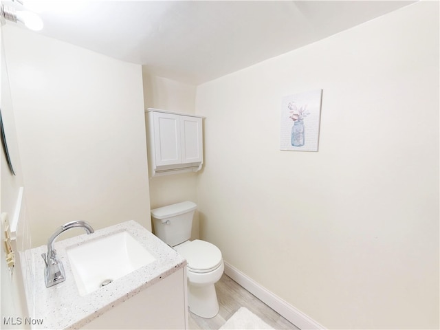 1907 Robindale St, Wickliffe, OH 44092 - half bath featuring vanity and wood finished floors