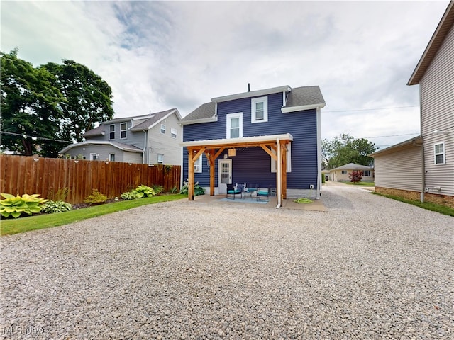 1907 Robindale St, Wickliffe, OH 44092 - back of house with gravel driveway and a patio area