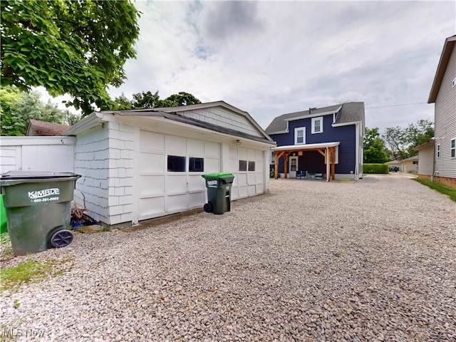 1907 Robindale St, Wickliffe, OH 44092 - rear view of house featuring a garage and an outdoor structure
