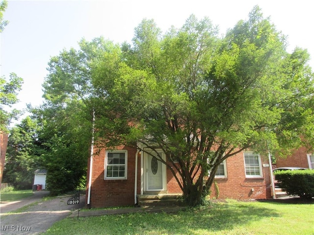 18019 Chagrin Blvd, Shaker Heights, OH 44122 - view of property hidden behind natural elements with brick siding and a front yard