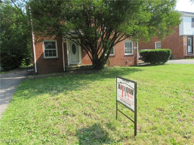 18019 Chagrin Blvd, Shaker Heights, OH 44122 - obstructed view of property with a front yard and brick siding
