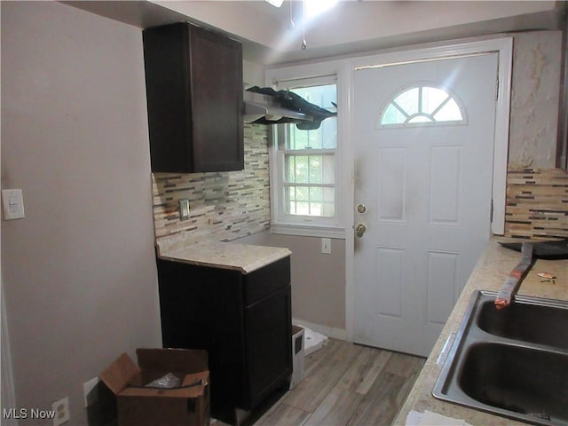 18019 Chagrin Blvd, Shaker Heights, OH 44122 - kitchen with light countertops, tasteful backsplash, and light wood-style floors