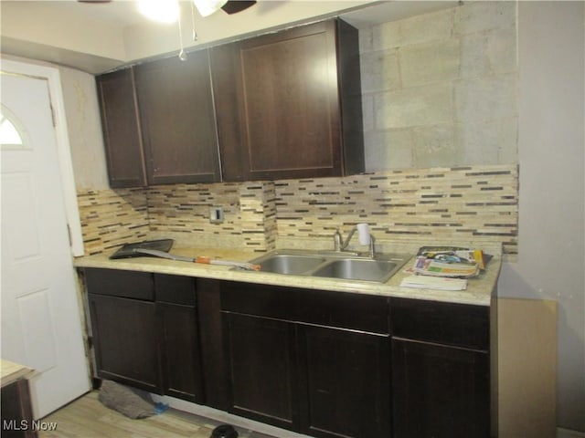 18019 Chagrin Blvd, Shaker Heights, OH 44122 - kitchen with light countertops, decorative backsplash, a ceiling fan, and light wood-style floors