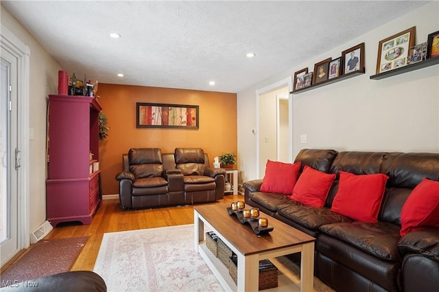 13 S River Rd, Munroe Falls, OH 44262 - living area with light wood-type flooring, recessed lighting, and a textured ceiling