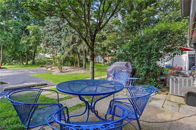 13 S River Rd, Munroe Falls, OH 44262 - view of patio / terrace with outdoor dining space and a grill