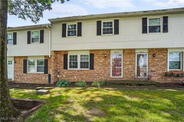 13 S River Rd, Munroe Falls, OH 44262 - townhome / multi-family property with brick siding and a front yard