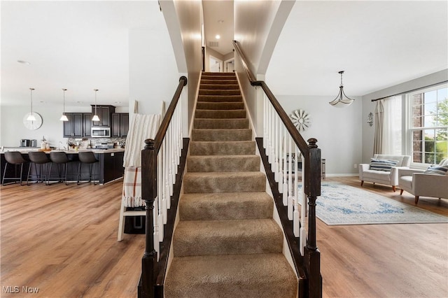 2979 Cloverhurst St NE, Canton, OH 44721 - stairs featuring wood finished floors and baseboards